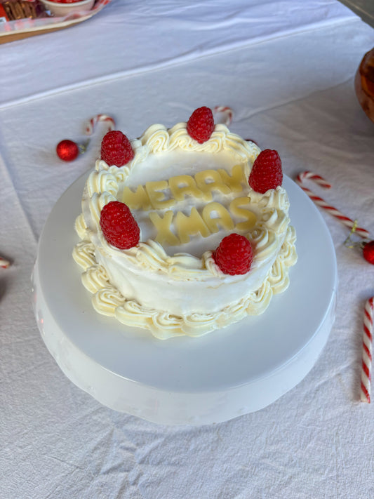 Cheese cake with whipped feta piping and Merry Christmas lettering